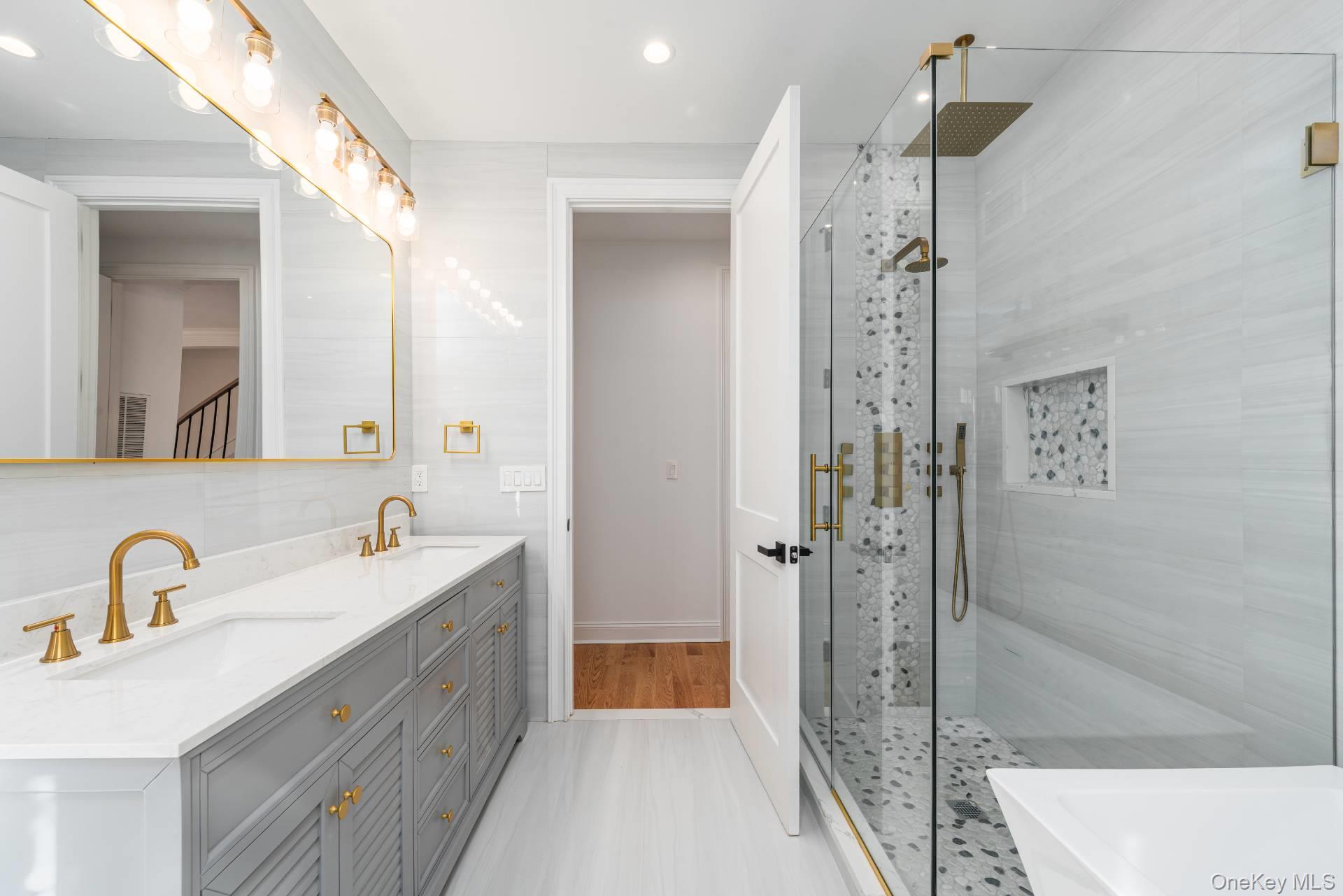 295 Grange Road Southold, NY 11971 - Photo 17 of 50 a bathroom with a sink a toilet and shower