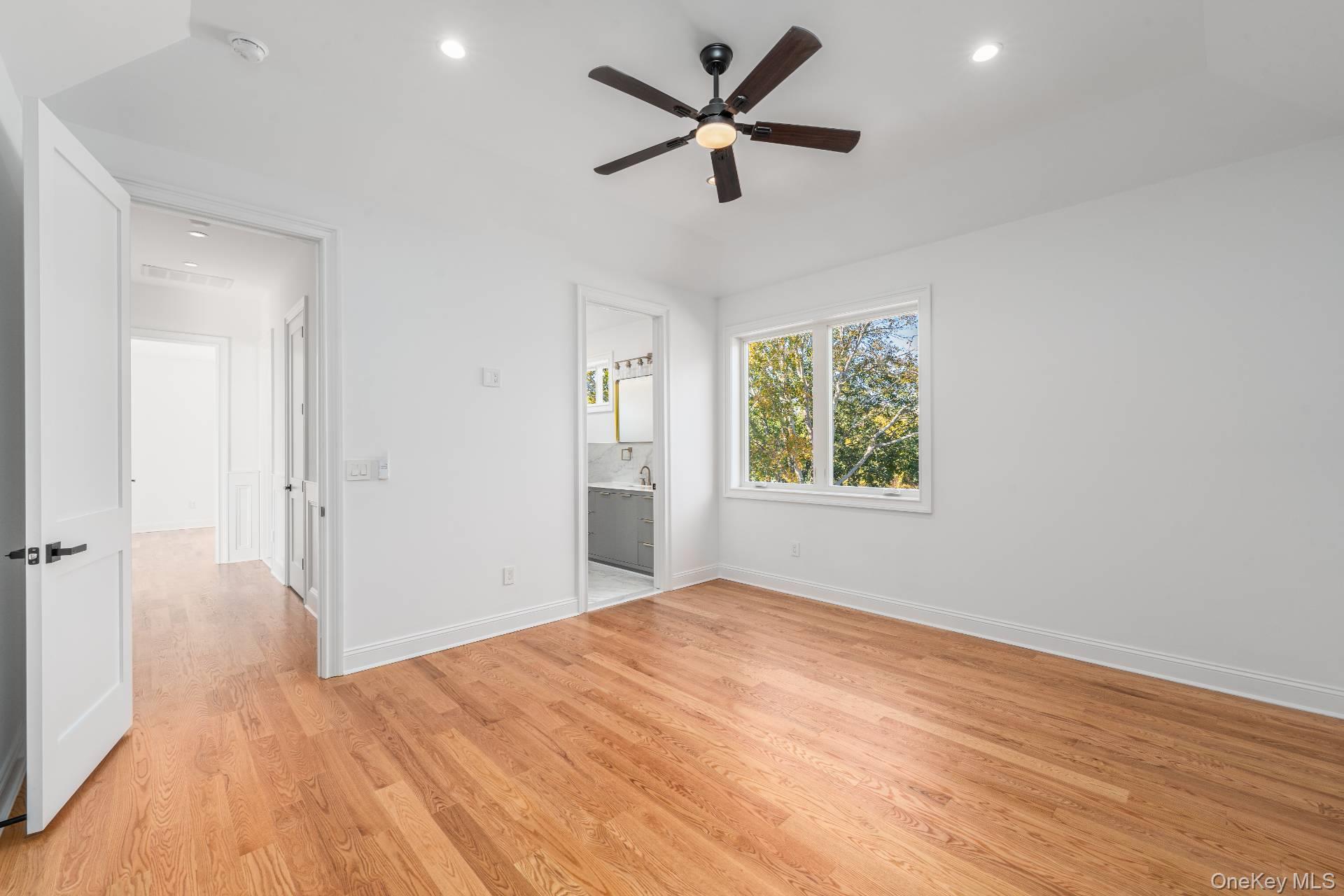 295 Grange Road Southold, NY 11971 - Photo 23 of 50 a view of empty room with wooden floor and fan