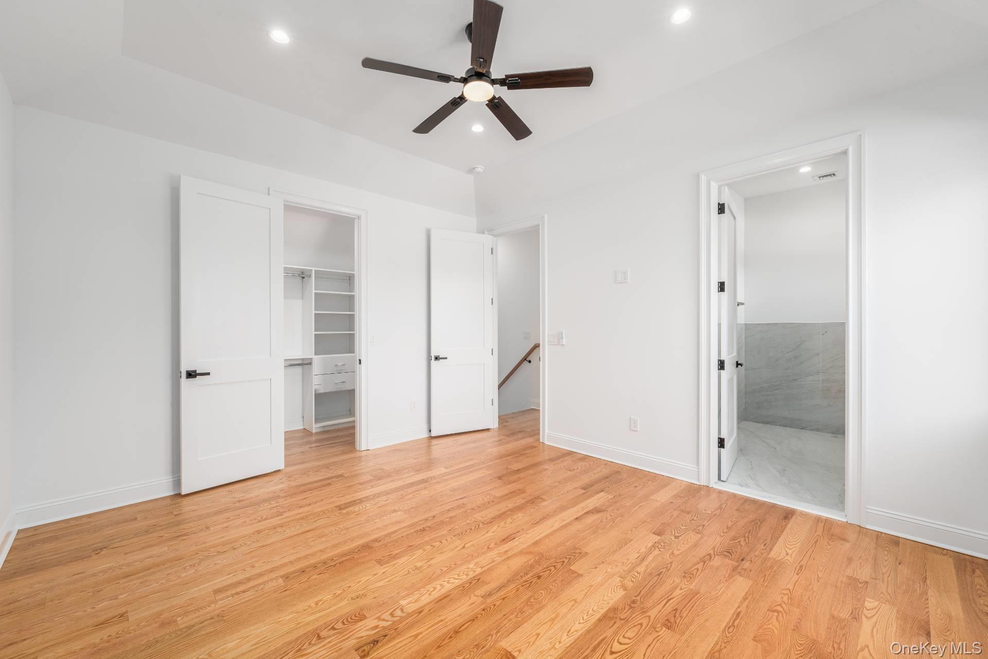 295 Grange Road Southold, NY 11971 - Photo 24 of 50 a view of empty room with wooden floor and ceiling fan