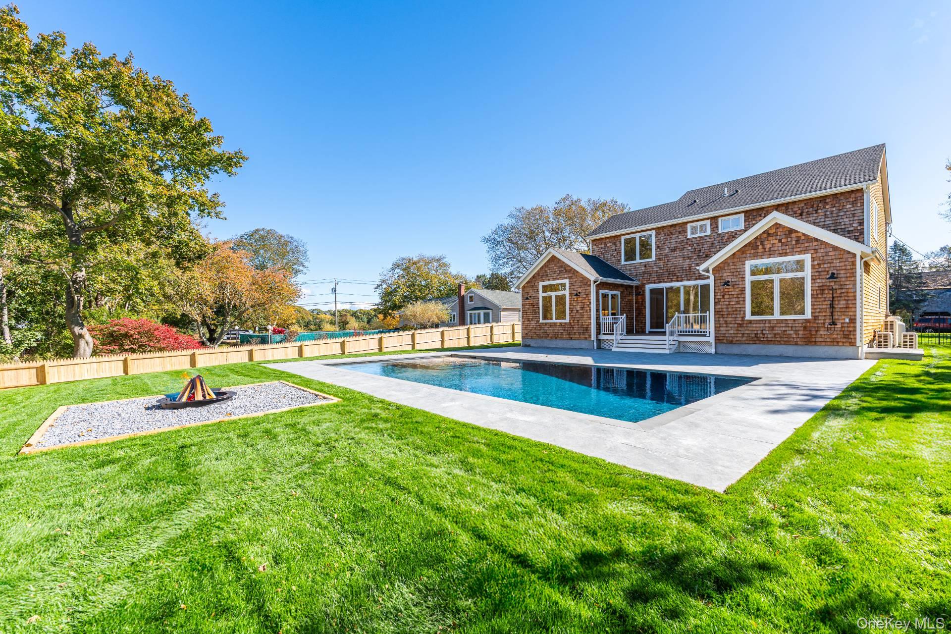 295 Grange Road Southold, NY 11971 - Photo 3 of 50 a view of a house with swimming pool and yard