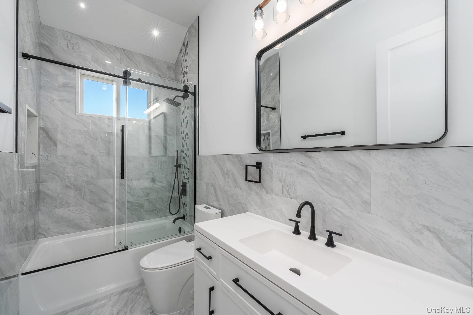 295 Grange Road Southold, NY 11971 - Photo 36 of 50 a bathroom with a sink toilet and shower