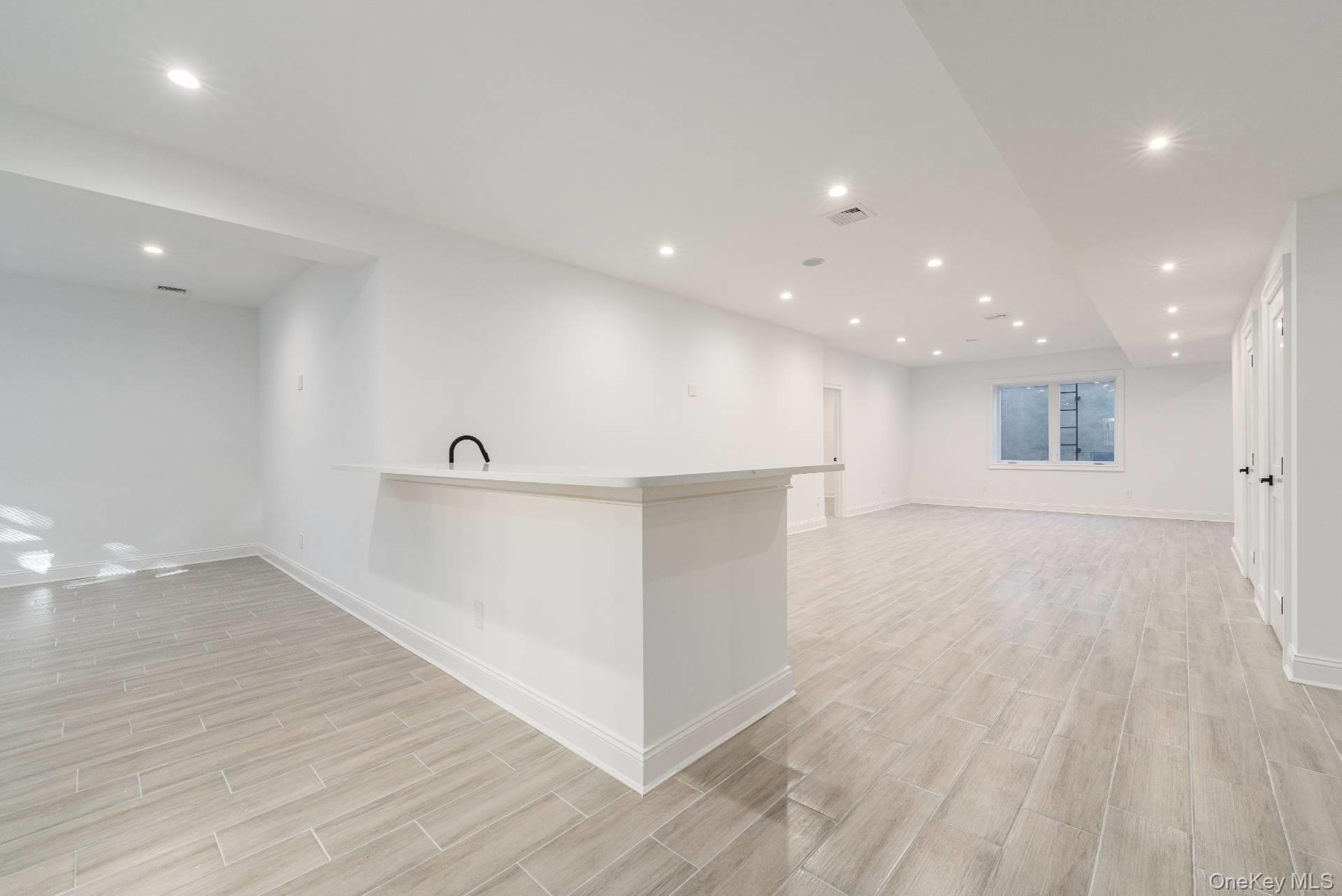 295 Grange Road Southold, NY 11971 - Photo 37 of 50 a view of an empty room with wooden floor