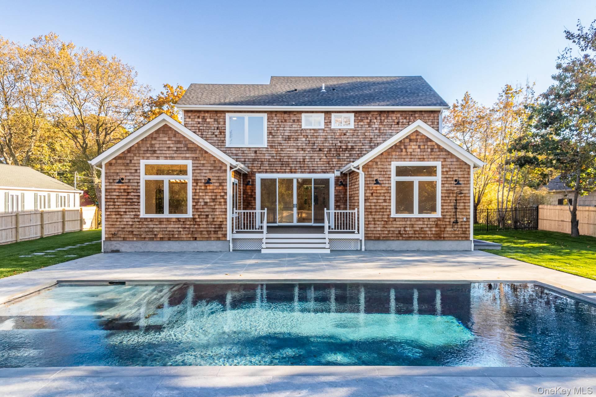 295 Grange Road Southold, NY 11971 - Photo 47 of 50 a front view of a house with a yard