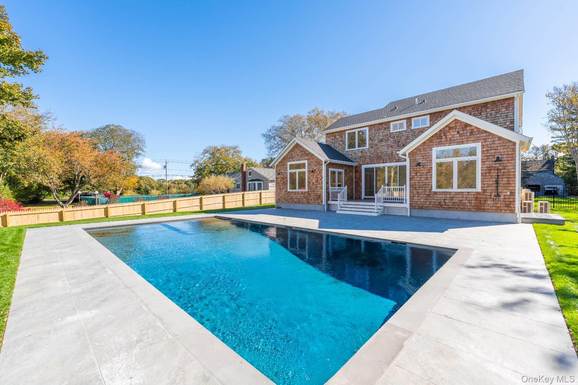 295 Grange Road Southold, NY 11971 - Photo 48 of 50 a view of swimming pool with outdoor seating and plants