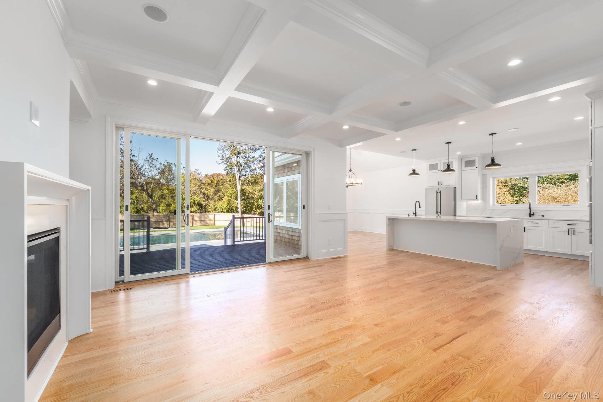 295 Grange Road Southold, NY 11971 - Photo 8 of 50 a view of a big room with wooden floor and windows