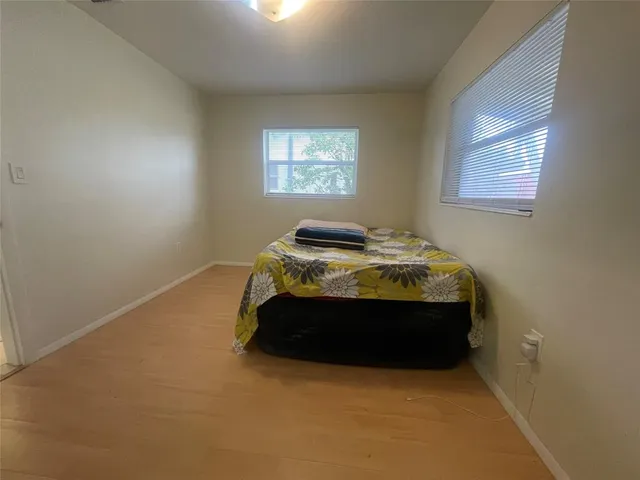 a bedroom with a bed and pillows