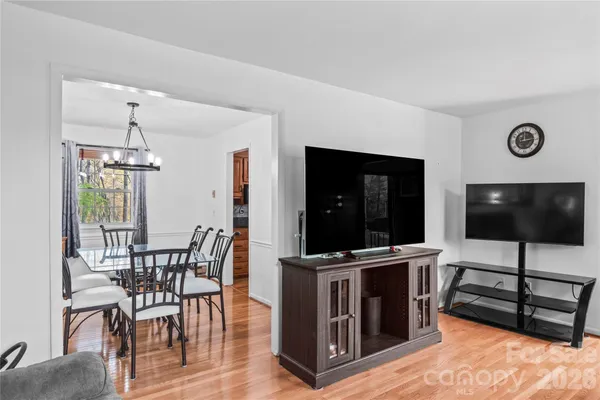 a view of a livingroom with furniture and flat screen tv