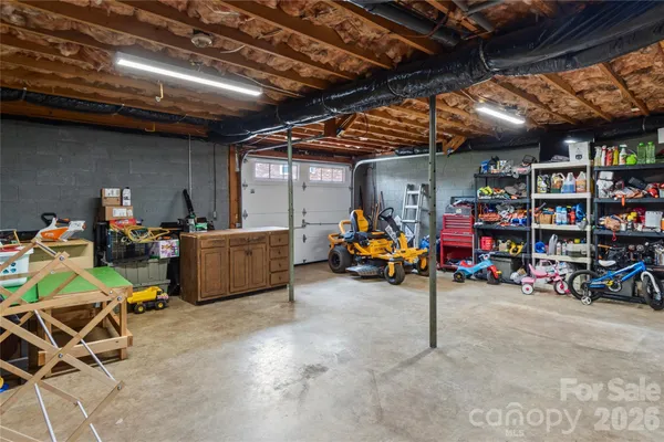 a view of a garage with a table and chairs