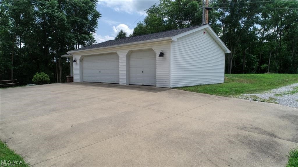 66333 Read Road Cambridge, OH 43725 - Photo 17 of 49 Garage featuring a yard
