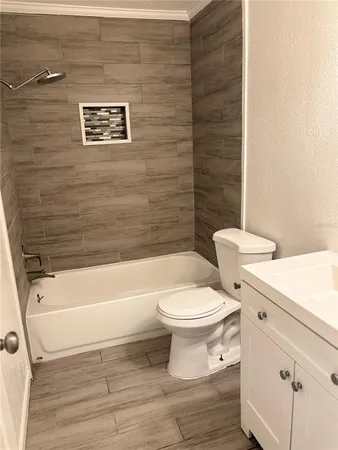 a bathroom with a toilet and a bathtub