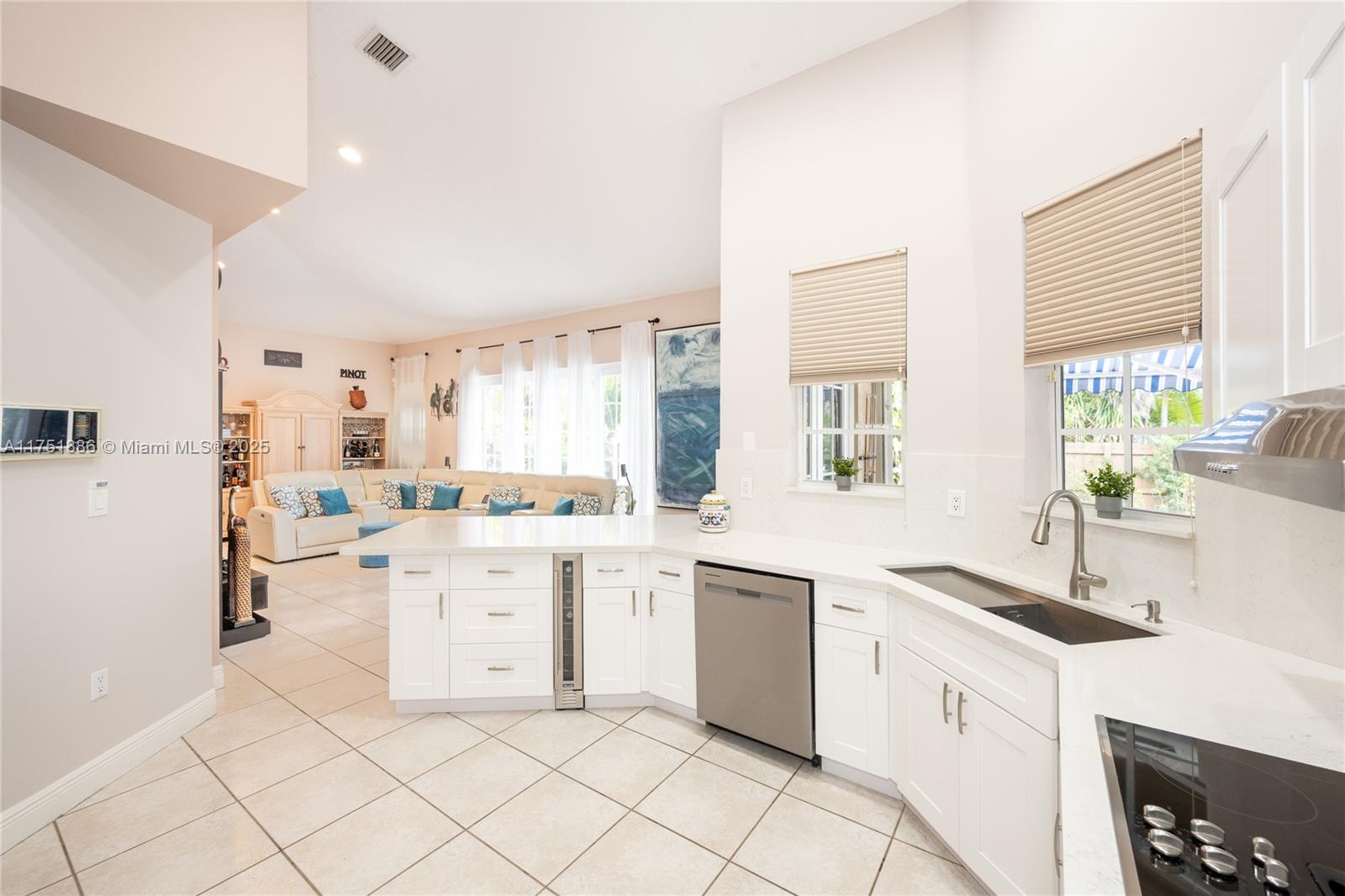 14201 Southwest 34th Street Miami, FL 33175 - Photo 12 of 33 a kitchen with cabinets and sink