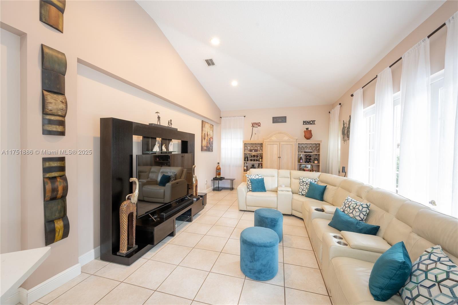 14201 Southwest 34th Street Miami, FL 33175 - Photo 15 of 33 a living room with furniture and a flat screen tv