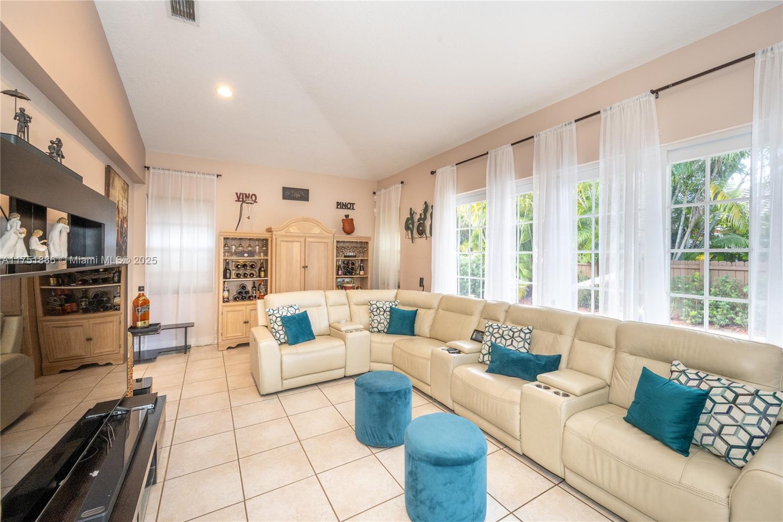 14201 Southwest 34th Street Miami, FL 33175 - Photo 16 of 33 a living room with furniture and a large window