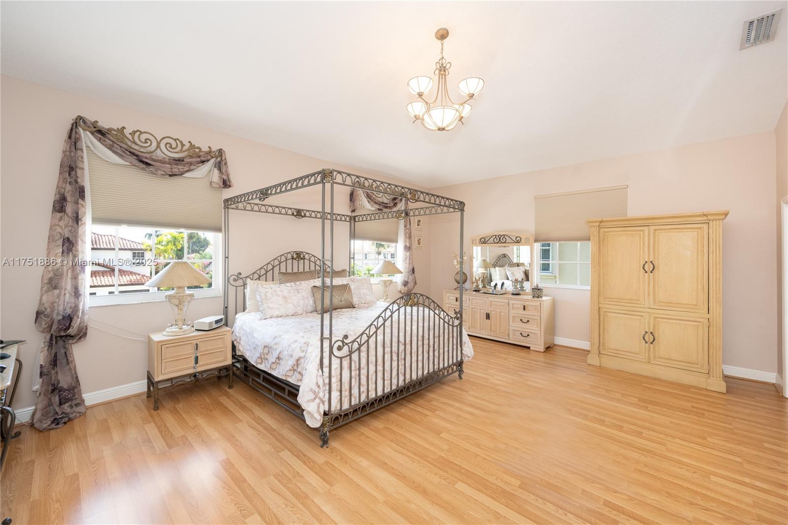 14201 Southwest 34th Street Miami, FL 33175 - Photo 17 of 33 a bedroom with furniture and a wooden floor