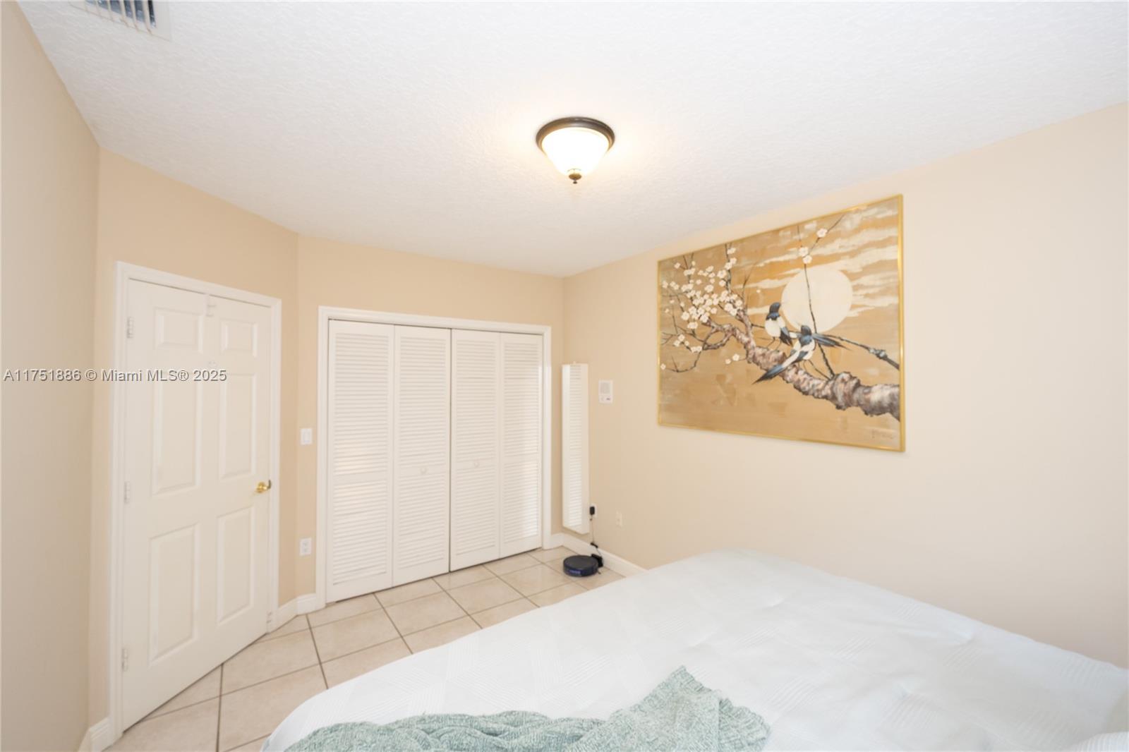 14201 Southwest 34th Street Miami, FL 33175 - Photo 23 of 33 a view of a room with wooden floor and cabinet