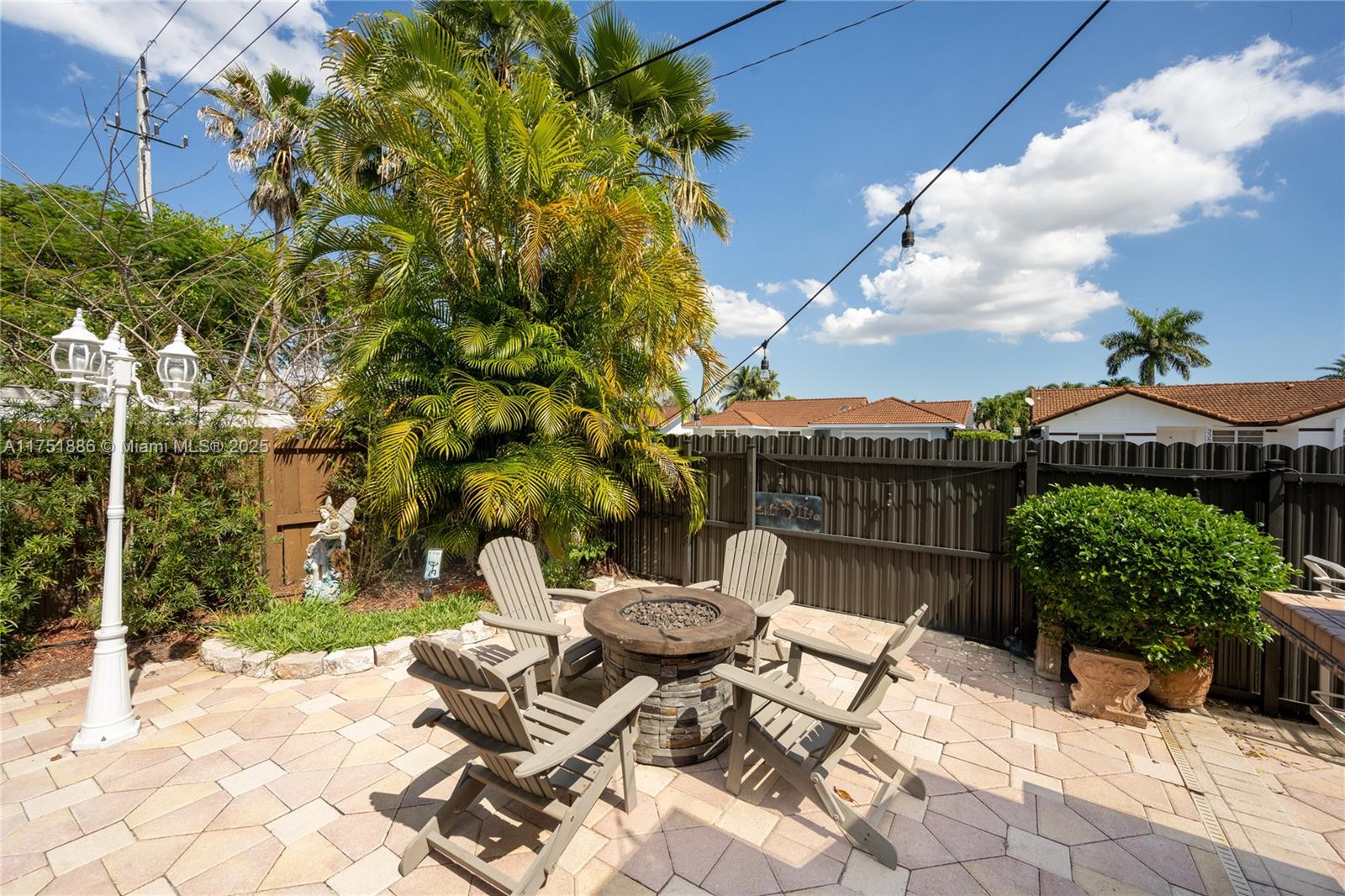 14201 Southwest 34th Street Miami, FL 33175 - Photo 3 of 33 a view of a chairs and table in backyard