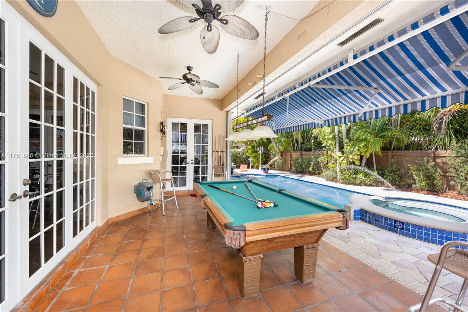14201 Southwest 34th Street Miami, FL 33175 - Photo 5 of 33 a room with pool table and windows