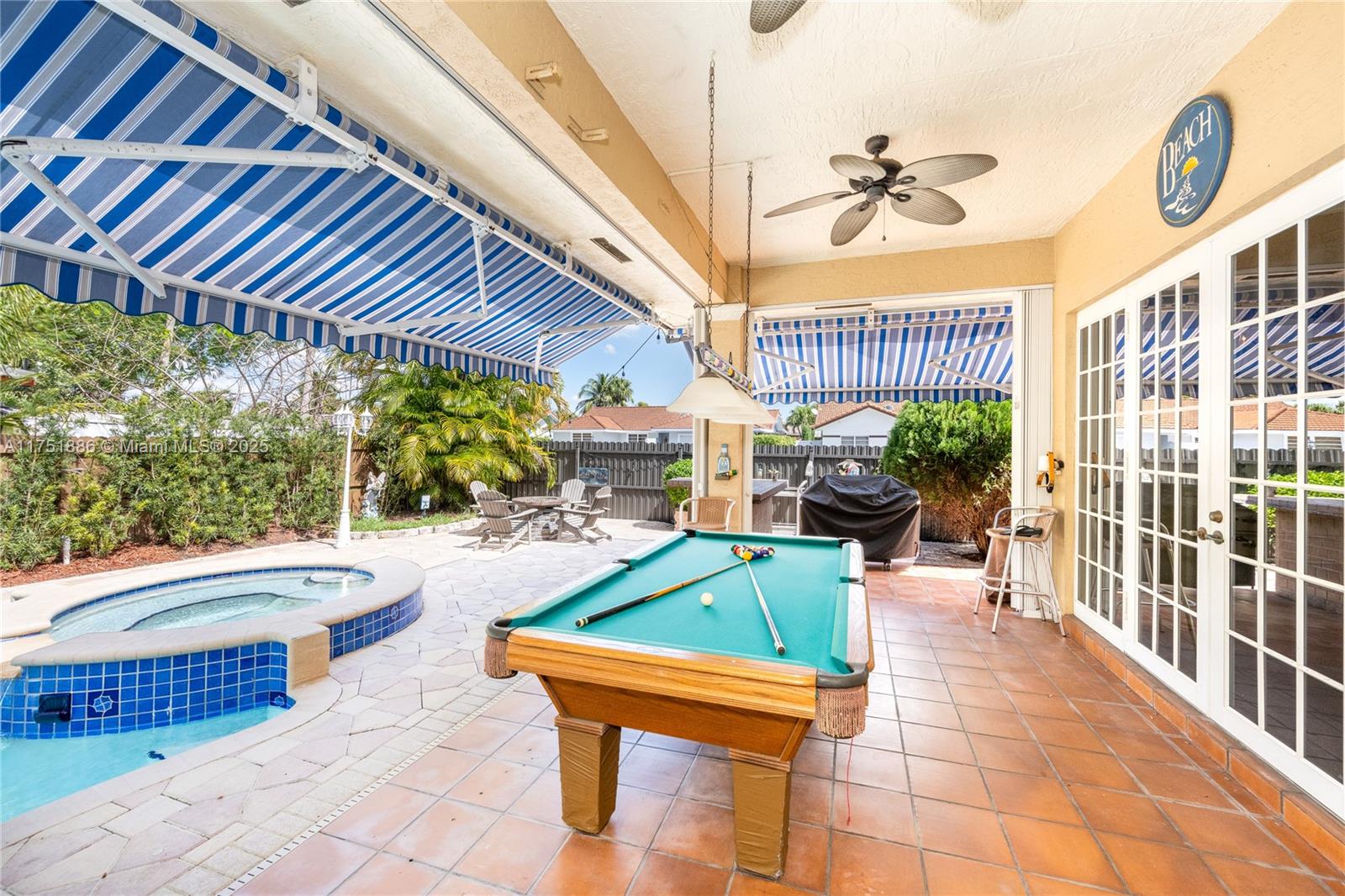 14201 Southwest 34th Street Miami, FL 33175 - Photo 6 of 33 a patio with water fountain and outdoor seating