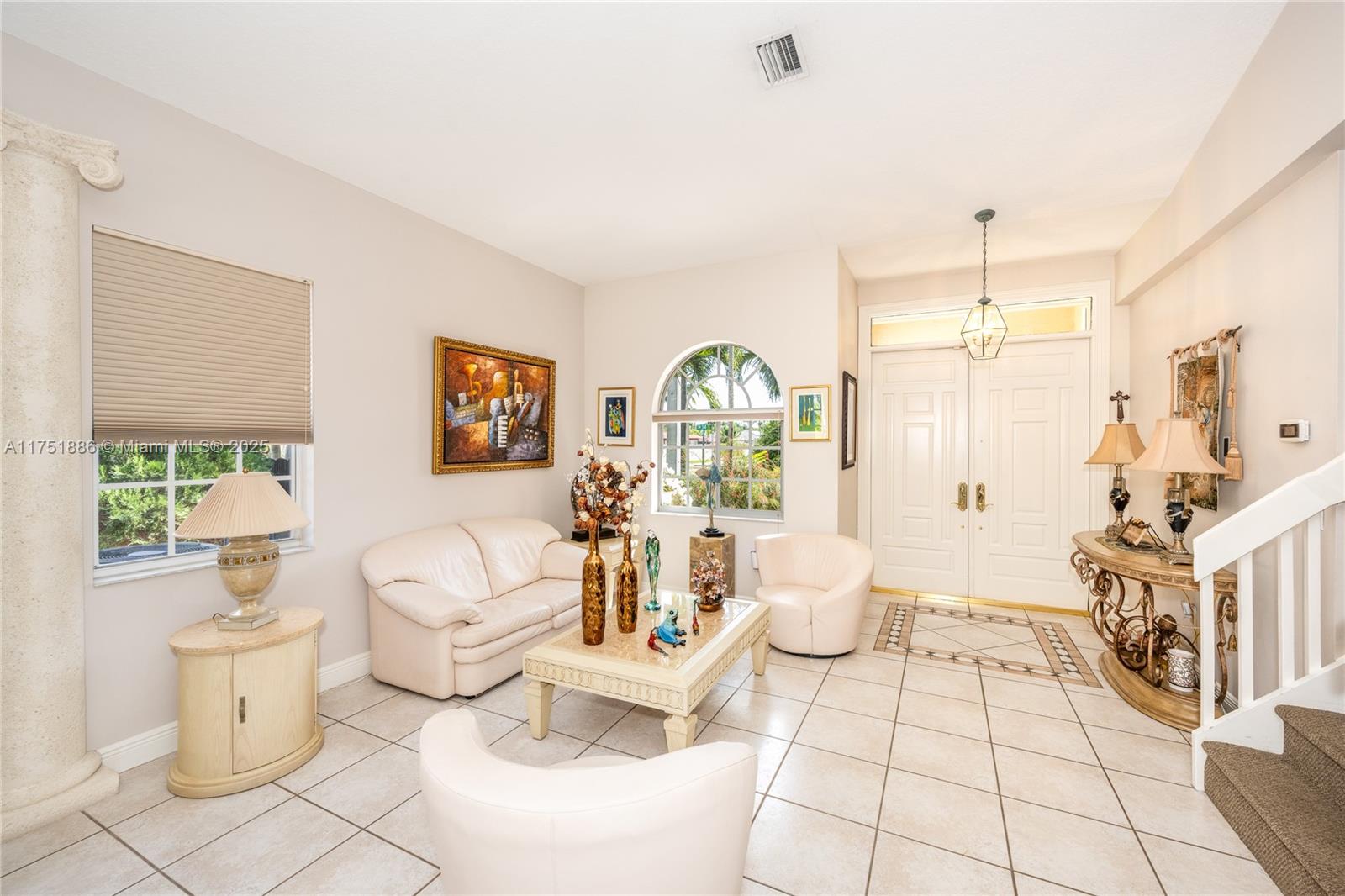 14201 Southwest 34th Street Miami, FL 33175 - Photo 7 of 33 a living room with furniture and a chandelier