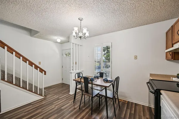 a kitchen with stainless steel appliances granite countertop a refrigerator stove microwave and sink