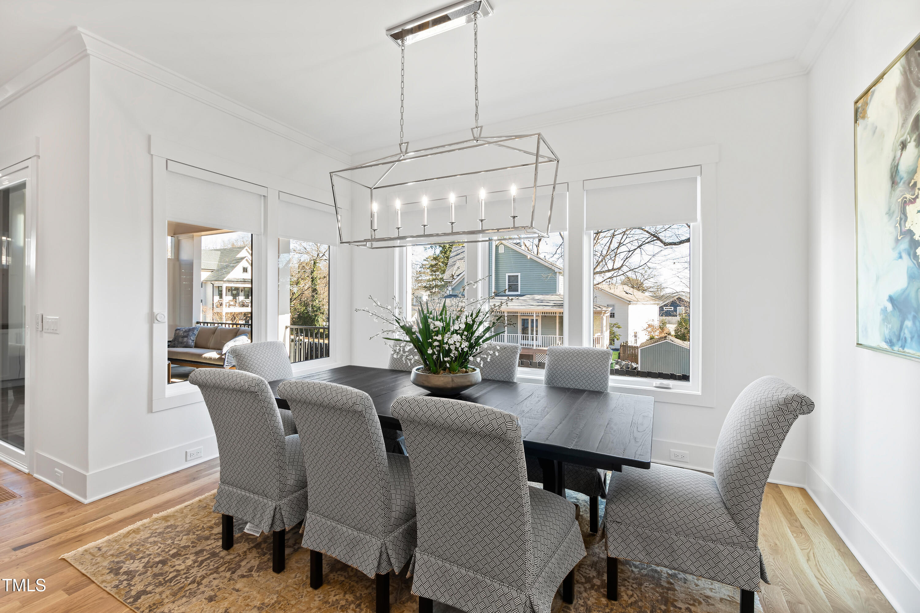 1610 Carson Street Raleigh, NC 27608 - Photo 19 of 64 a view of a dining room with furniture wooden floor and chandelier