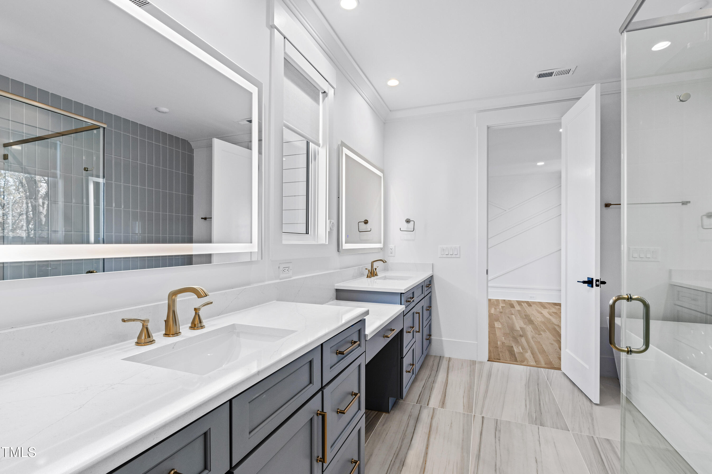 1610 Carson Street Raleigh, NC 27608 - Photo 27 of 64 a spacious bathroom with a sink double vanity and a mirror