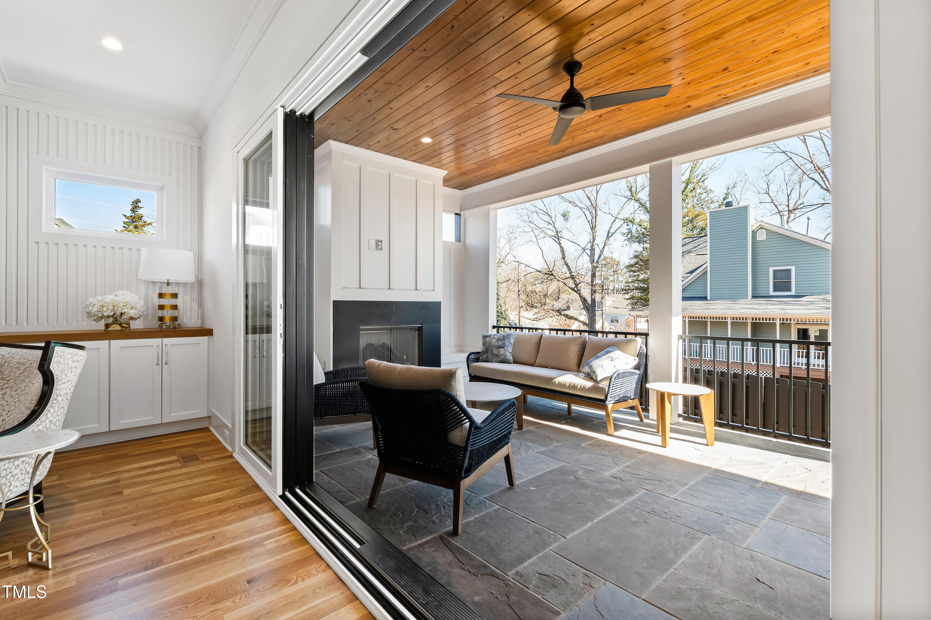 1610 Carson Street Raleigh, NC 27608 - Photo 30 of 64 a living room with furniture and a floor to ceiling window