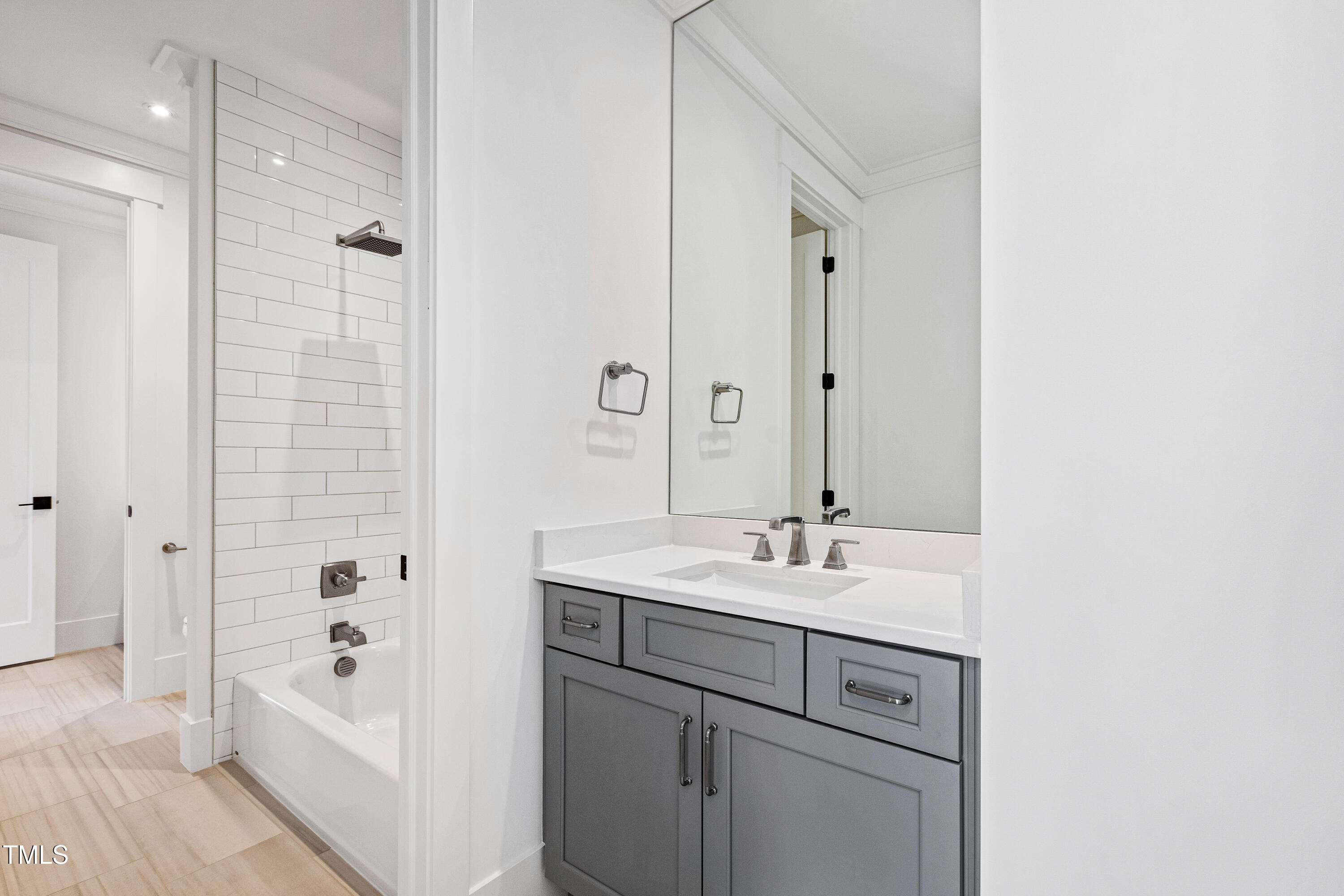 1610 Carson Street Raleigh, NC 27608 - Photo 41 of 64 a bathroom with a bathtub shower sink and mirror