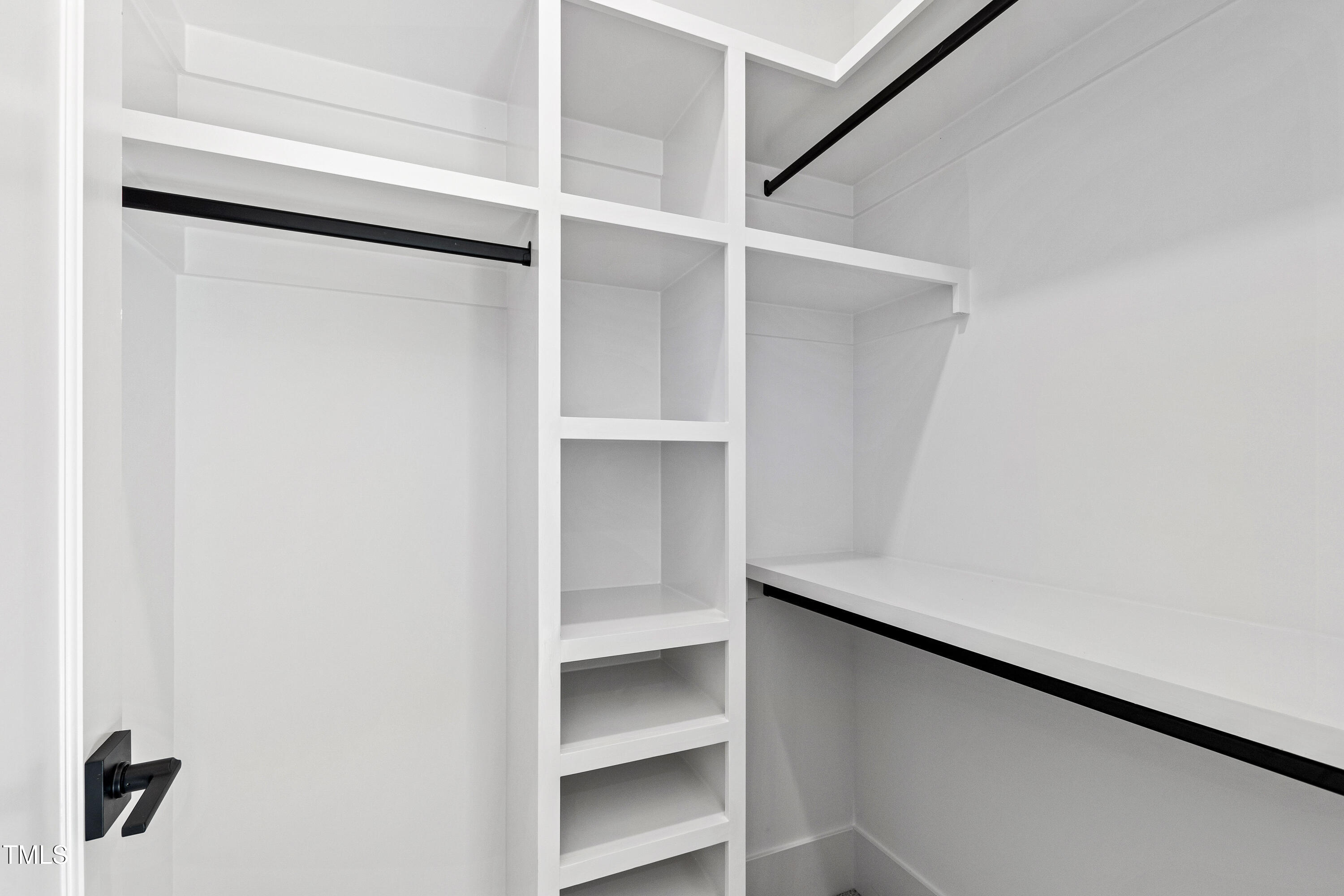 1610 Carson Street Raleigh, NC 27608 - Photo 45 of 64 a view of an empty walk in closet