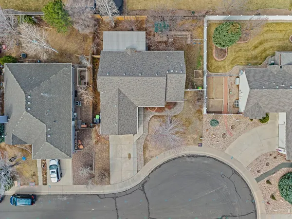 an aerial view of residential houses with outdoor space