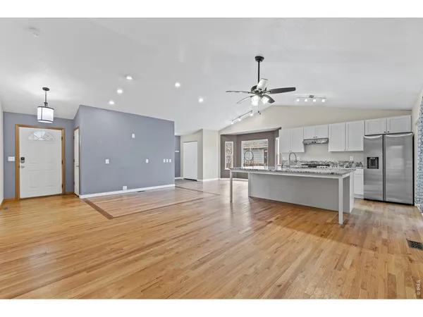 a view of kitchen with cabinets and wooden floor