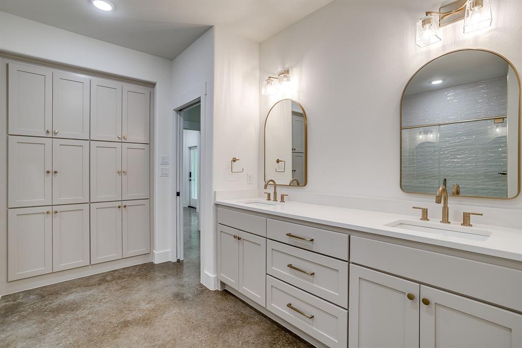 108 Cardinal Wds Granbury, TX 76049 - Photo 16 of 22 a bathroom with a double vanity sink and mirror