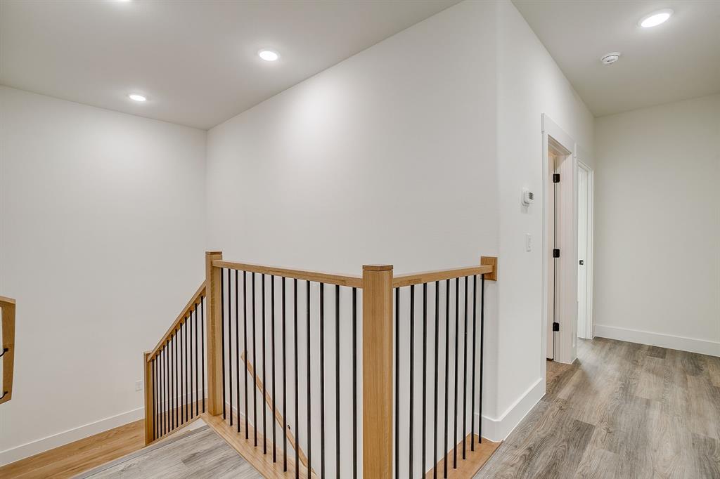 108 Cardinal Wds Granbury, TX 76049 - Photo 18 of 22 a view of a hallway with wooden floor