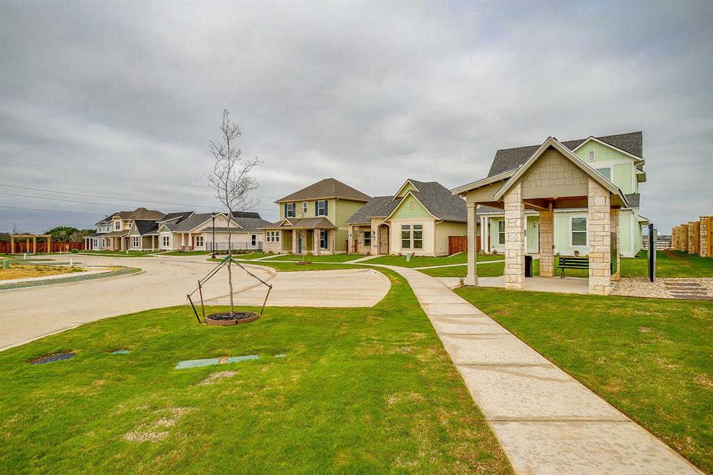 108 Cardinal Wds Granbury, TX 76049 - Photo 19 of 22 a view of an house with swimming pool garden view and a lake view