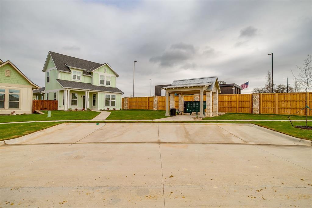 108 Cardinal Wds Granbury, TX 76049 - Photo 21 of 22 a view of an buildings with a swimming pool
