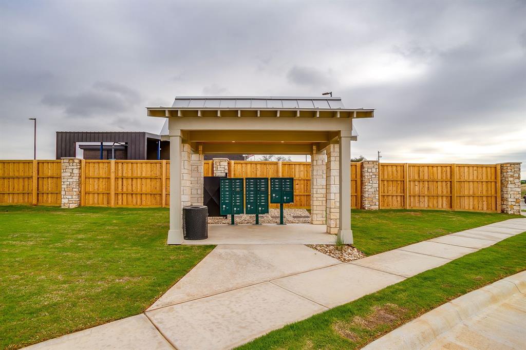108 Cardinal Wds Granbury, TX 76049 - Photo 22 of 22 a front view of house with a garden