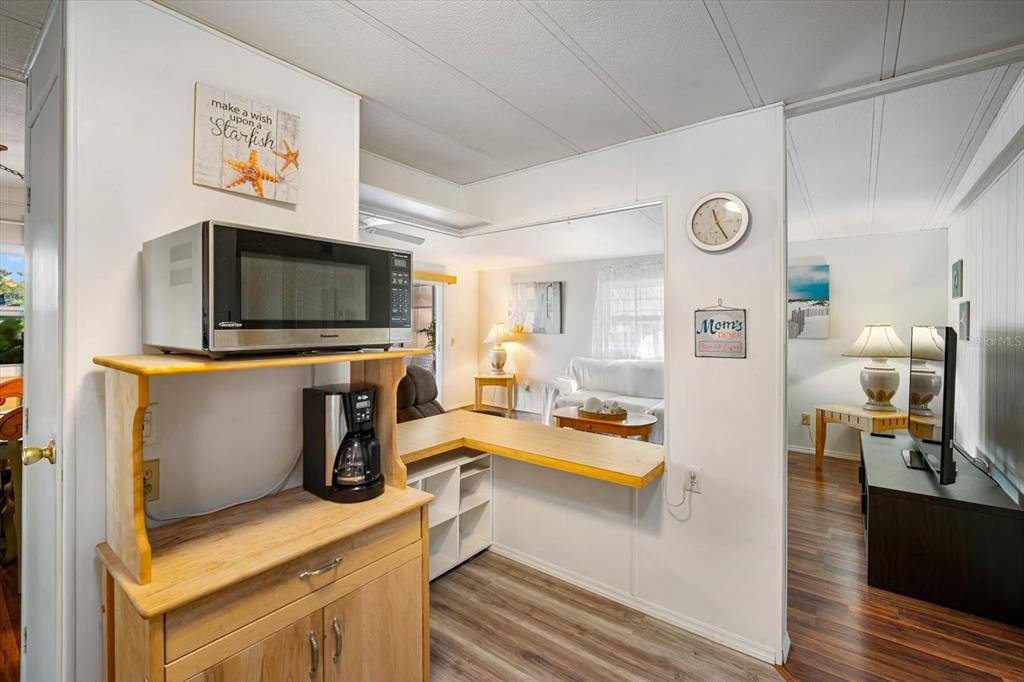 5619 Bayshore Road, Unit 417 Palmetto, FL 34221 - Photo 16 of 36 a view of living room with furniture and flat screen tv