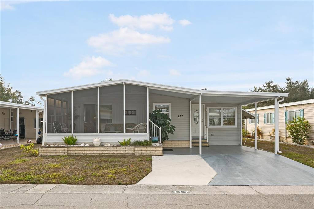 5619 Bayshore Road, Unit 417 Palmetto, FL 34221 - Photo 2 of 36 a view of a house with backyard porch and sitting area
