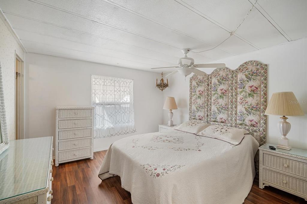 5619 Bayshore Road, Unit 417 Palmetto, FL 34221 - Photo 22 of 36 a spacious bedroom with a bed and a window