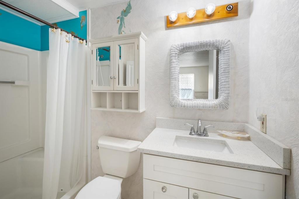 5619 Bayshore Road, Unit 417 Palmetto, FL 34221 - Photo 23 of 36 a bathroom with a sink toilet and shower