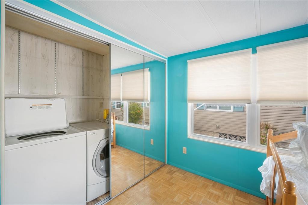 5619 Bayshore Road, Unit 417 Palmetto, FL 34221 - Photo 26 of 36 a utility room with a window dryer and washer