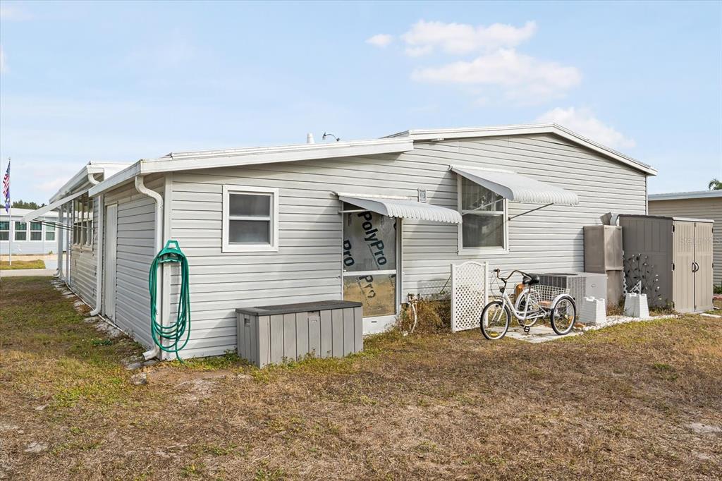 5619 Bayshore Road, Unit 417 Palmetto, FL 34221 - Photo 4 of 36 a view of a house with wooden wall and a large window