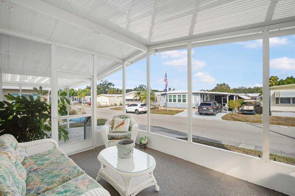 5619 Bayshore Road, Unit 417 Palmetto, FL 34221 - Photo 8 of 36 a room with lots of table chair and a large window