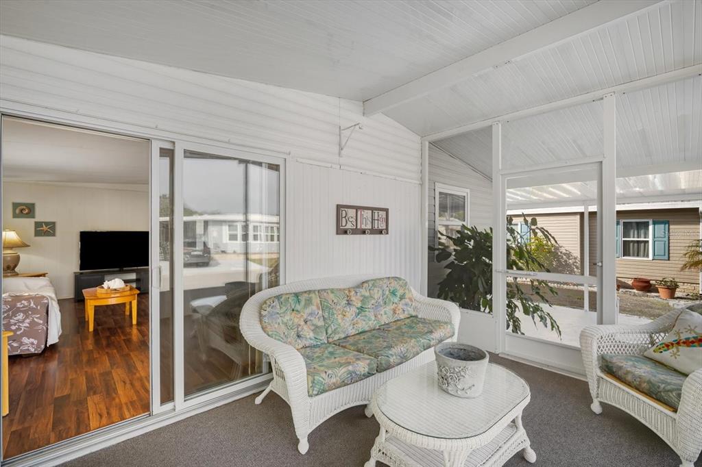 5619 Bayshore Road, Unit 417 Palmetto, FL 34221 - Photo 9 of 36 a living room with furniture and a flat screen tv
