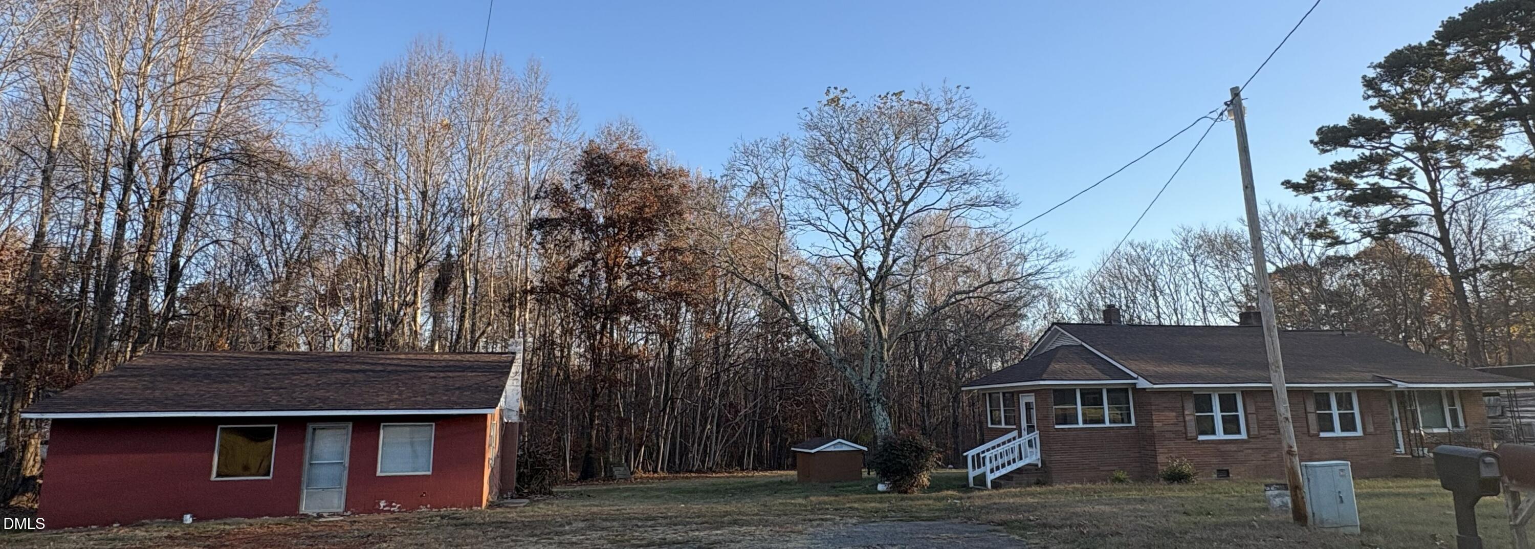6803 High Rock Road Efland, NC 27243 - Photo 11 of 11 a front view of house with yard and trees in the background