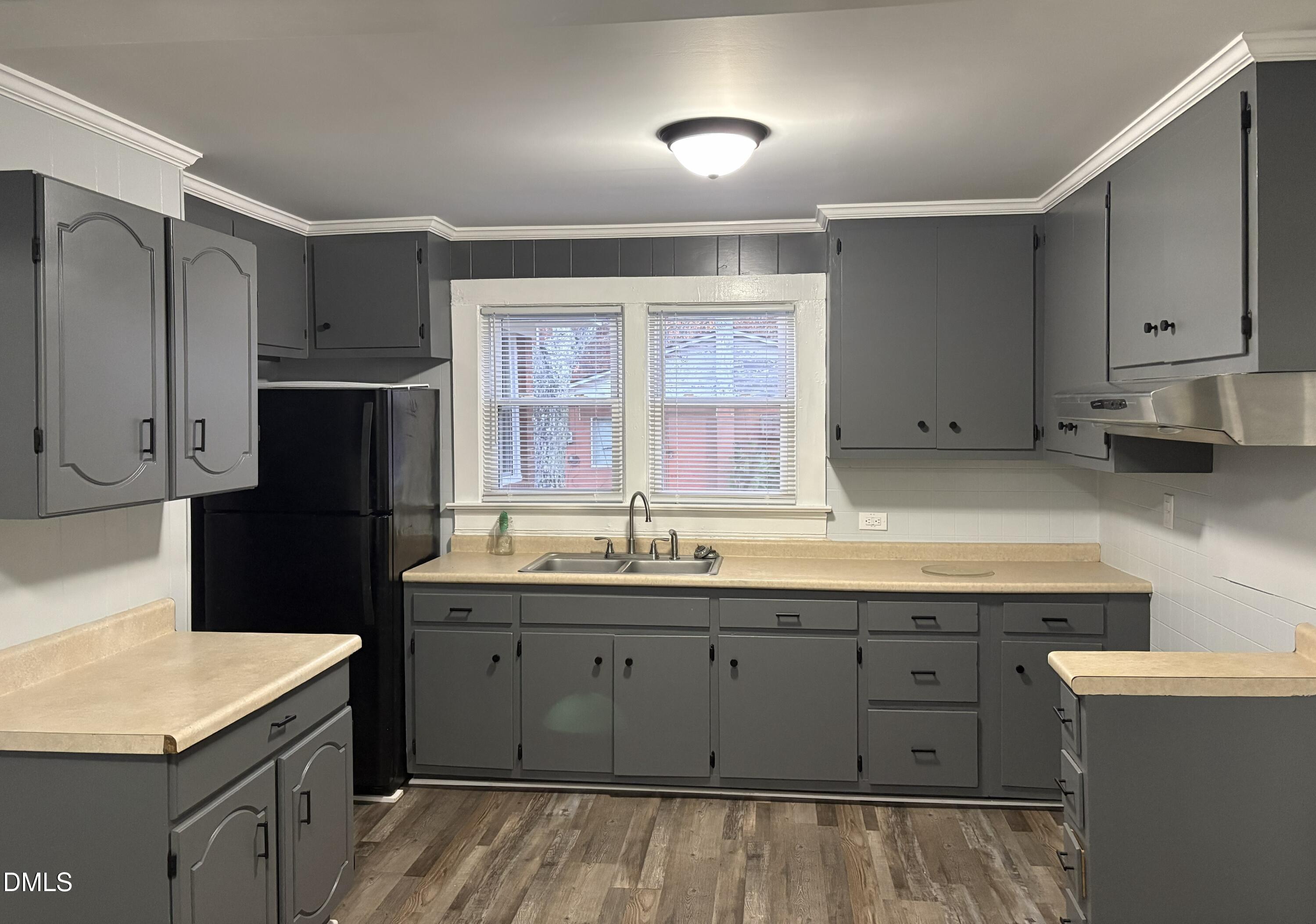 6803 High Rock Road Efland, NC 27243 - Photo 2 of 11 a kitchen with a sink refrigerator and cabinets