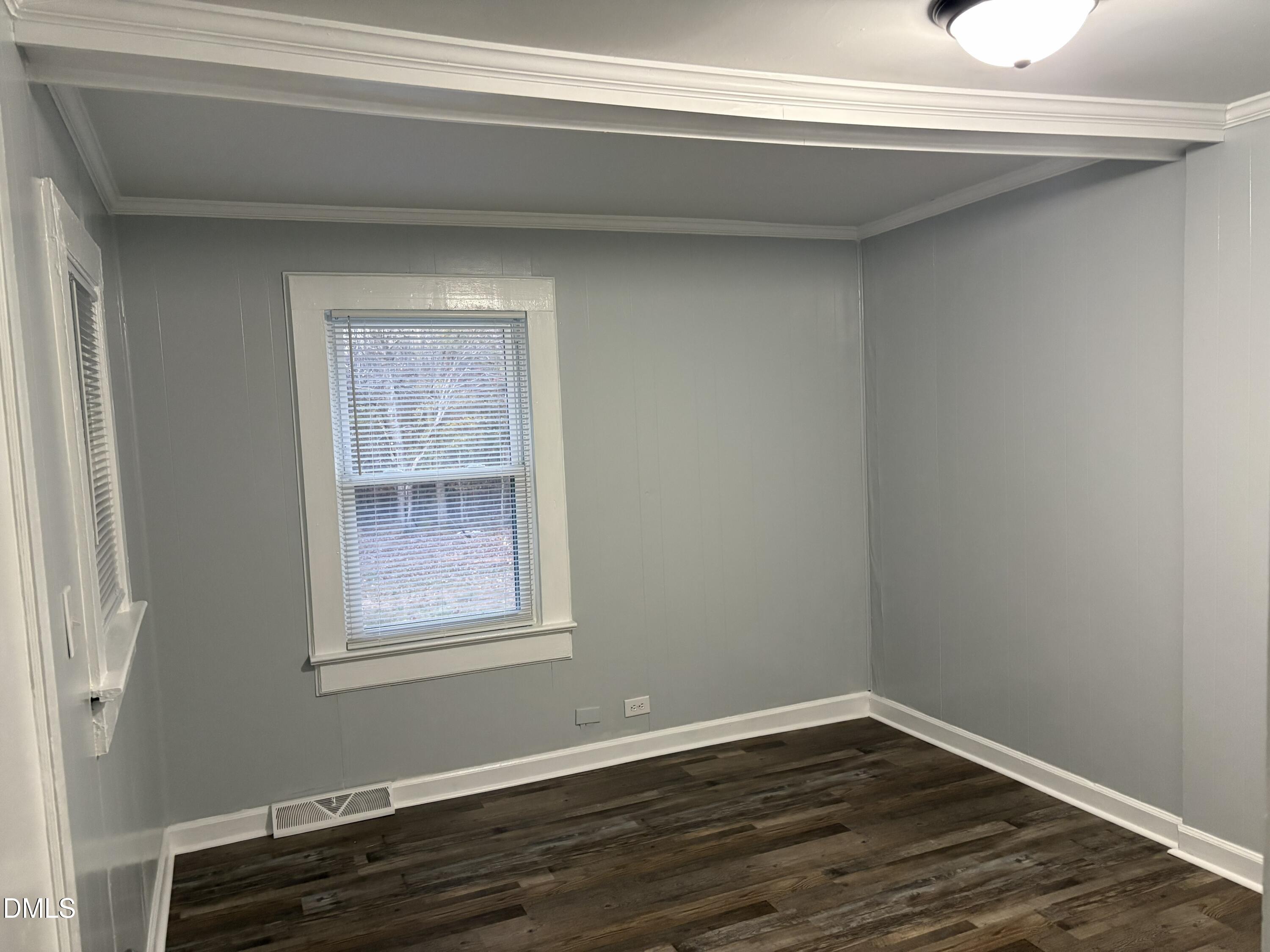 6803 High Rock Road Efland, NC 27243 - Photo 6 of 11 a view of an empty room with wooden floor and a window