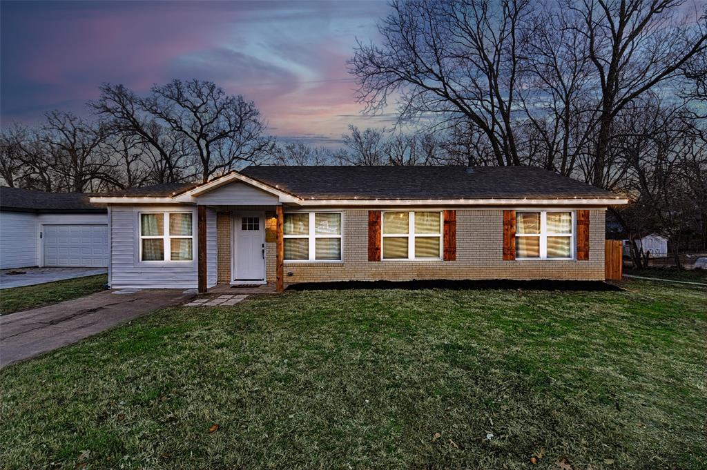 1201 Ridgewood Road Denison, TX 75020 - Photo 2 of 29 Single story home with a garage and a lawn