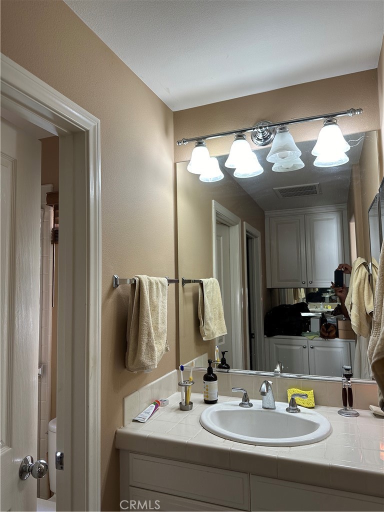 139 Canyoncrest Irvine, CA 92603 - Photo 5 of 5 a bathroom with a sink and a mirror