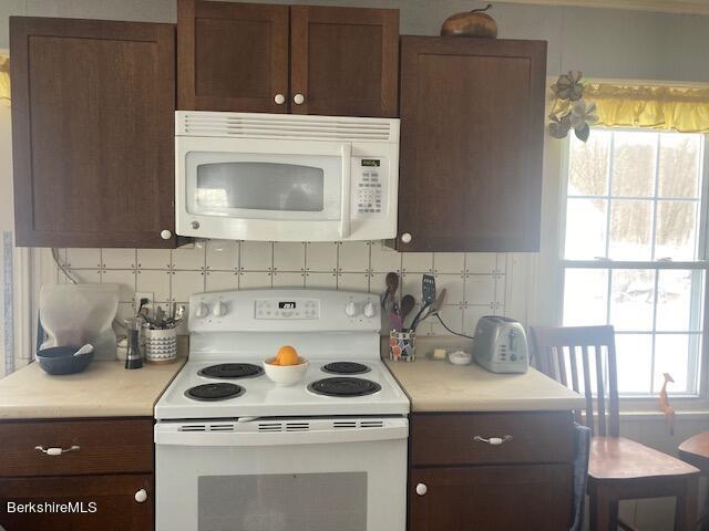 15 State Line Road West Stockbridge, MA 01266 - Photo 3 of 16 a white stove top oven sitting inside of a kitchen